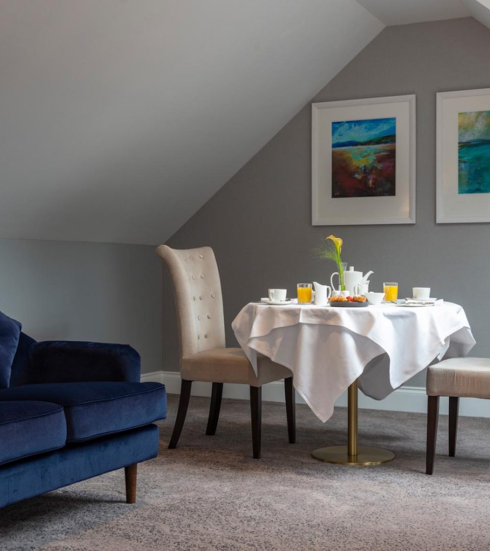 Table set for breakfast in bedroom lounge