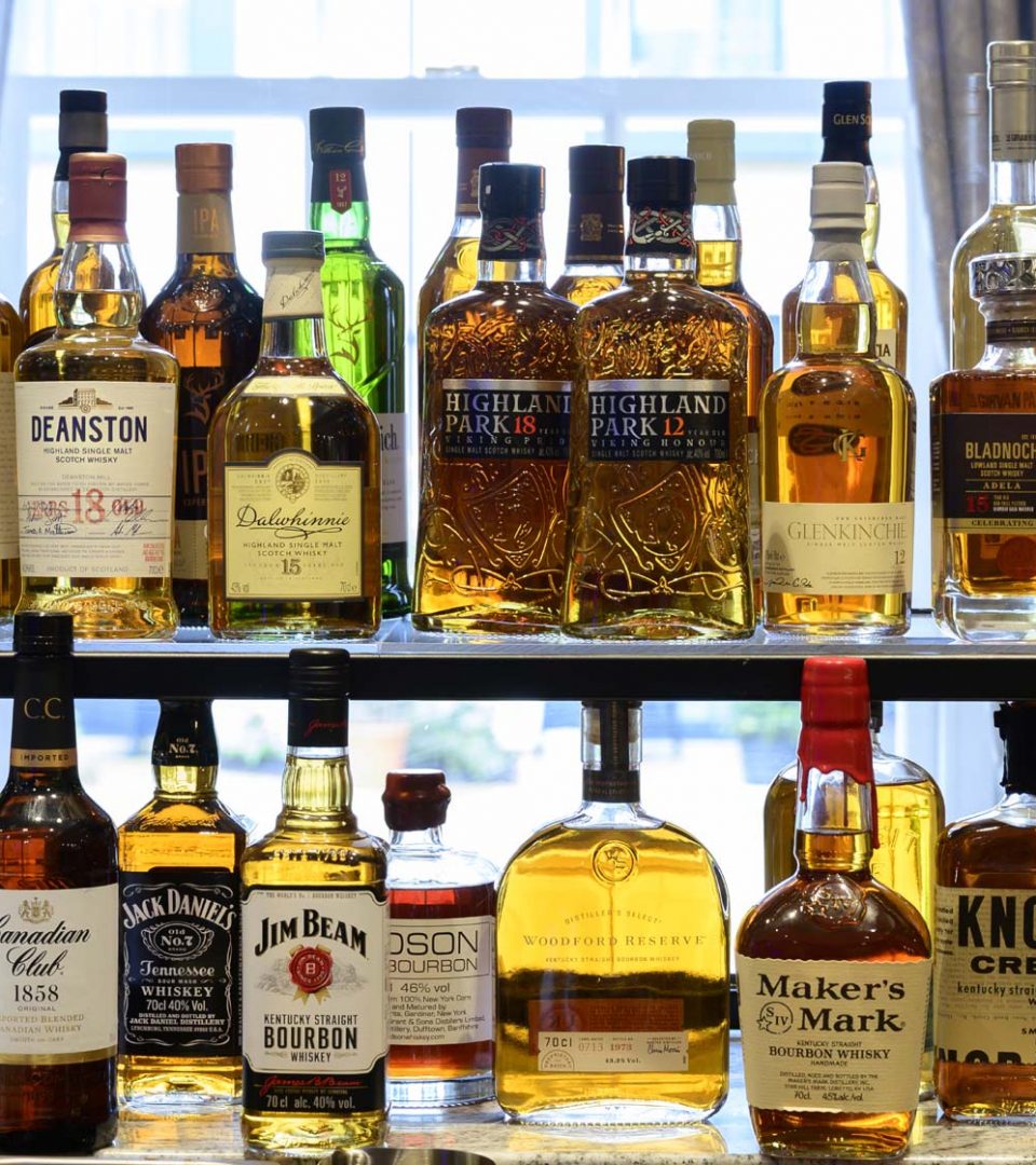 Selection of whiskies behind bar