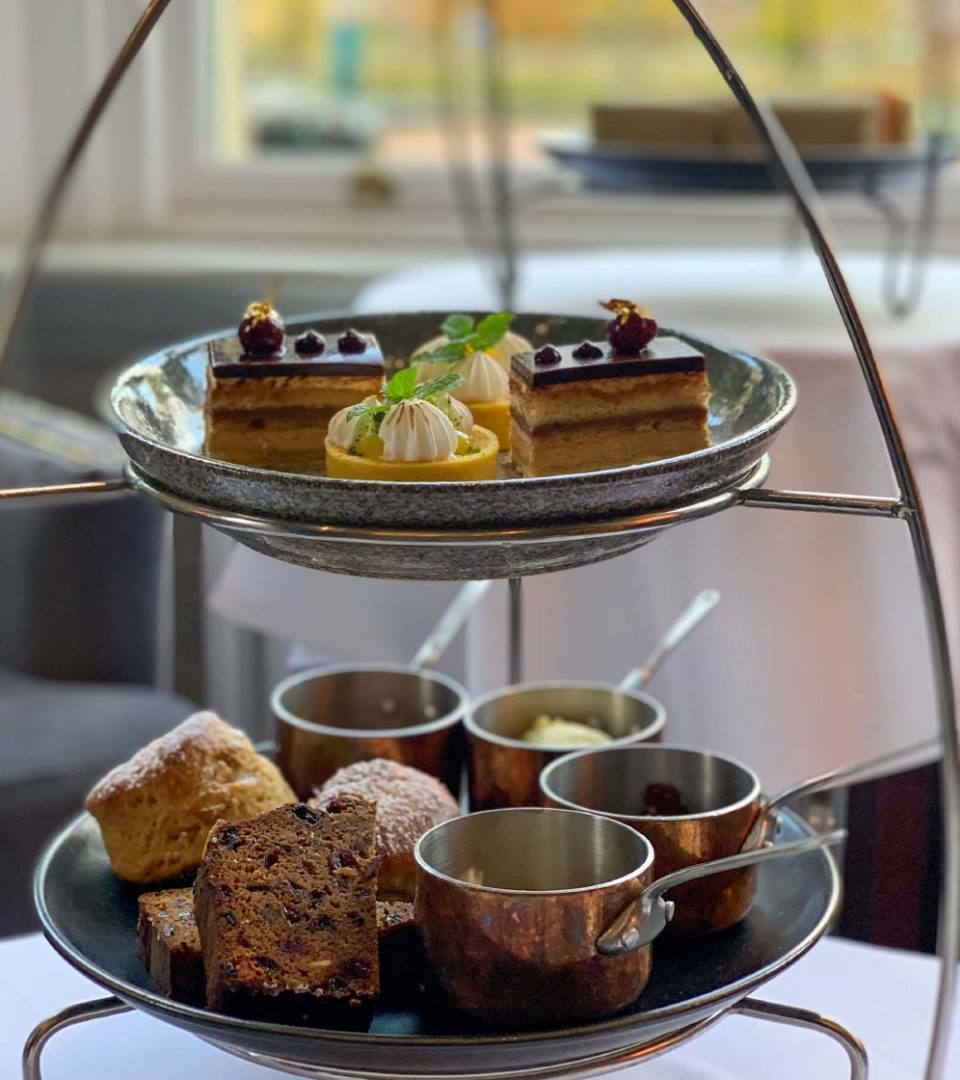 Scones and sweet cakes on a two tiered stand