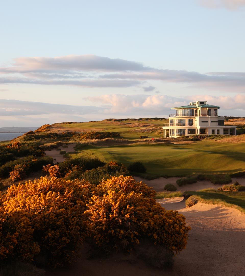 Castle Stuart golf hole with Art Deco clubhouse in the background