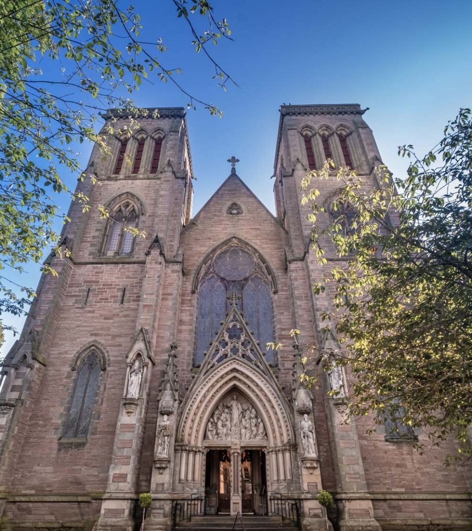 View looking up at Inverness Cathedral on the banks of the River Ness