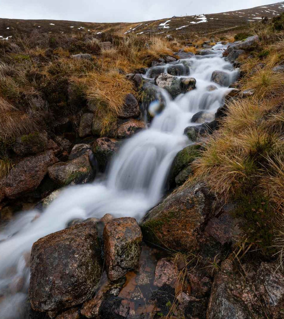 River flowing through Cairngorm Mountains