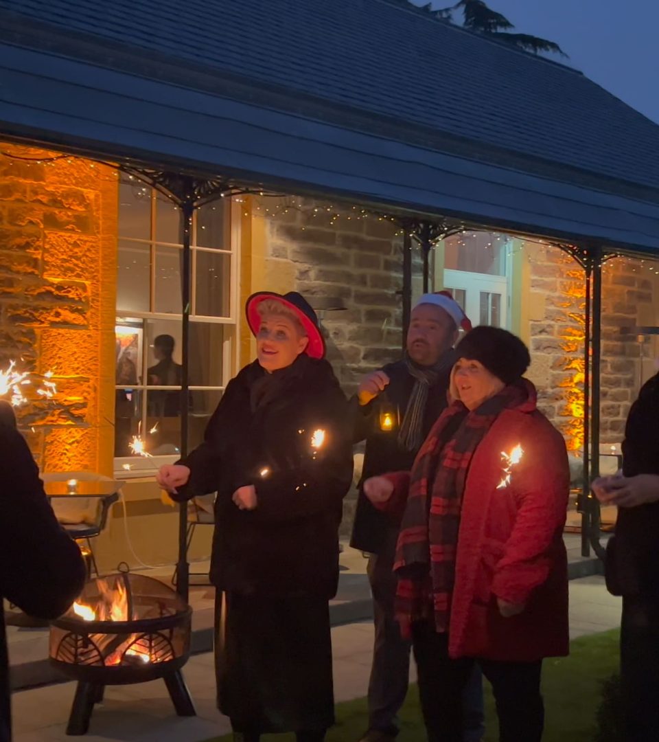 Carol Singers next to Victorian Terrace for Christmas Yuletide experience