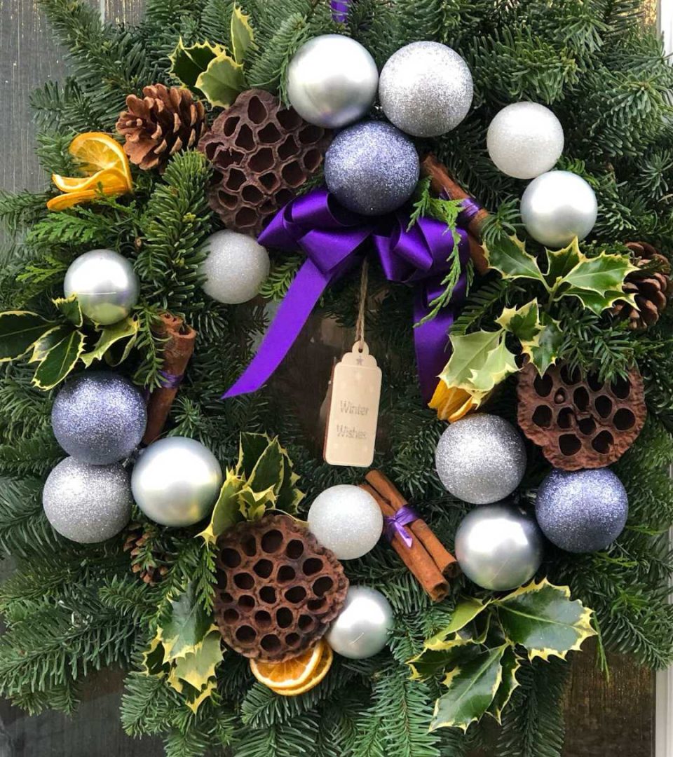 Purple spruce festive wreath made at a workshop by Flowers by Lee