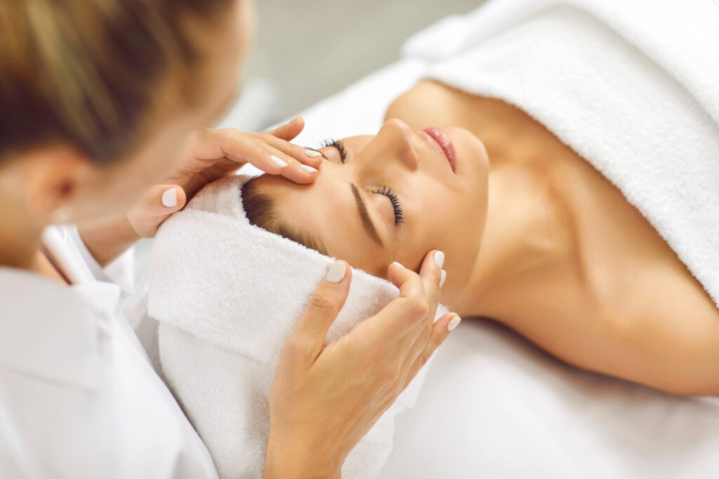 Woman enjoying a spa facial treatment