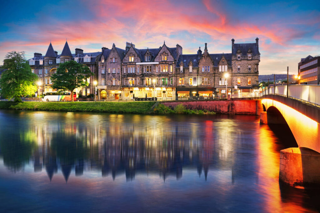 Inverness skyline with castle reflection in Ness river